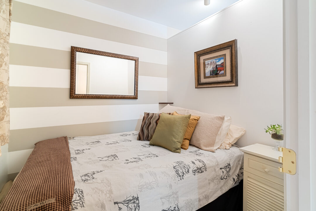 small loft area room with white and beige wallls