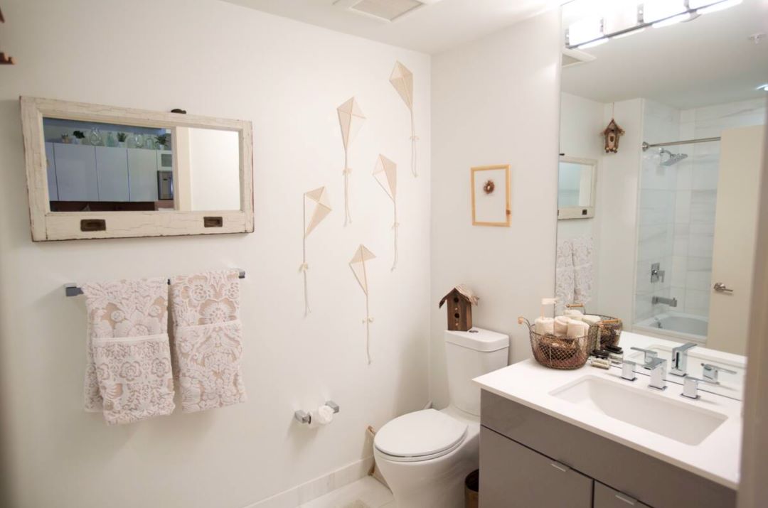 small white bathroom with modern vanity
