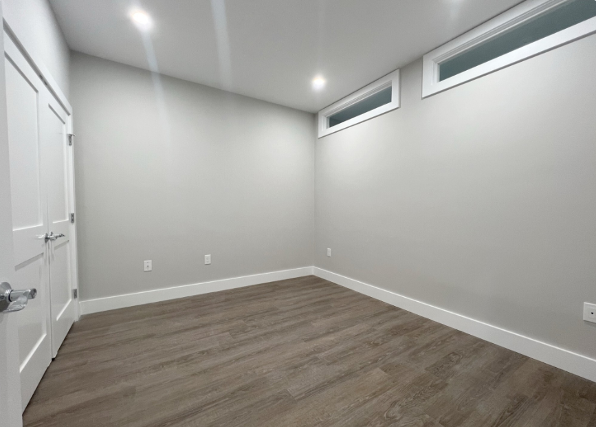 Bedroom with hardwood floors and closet