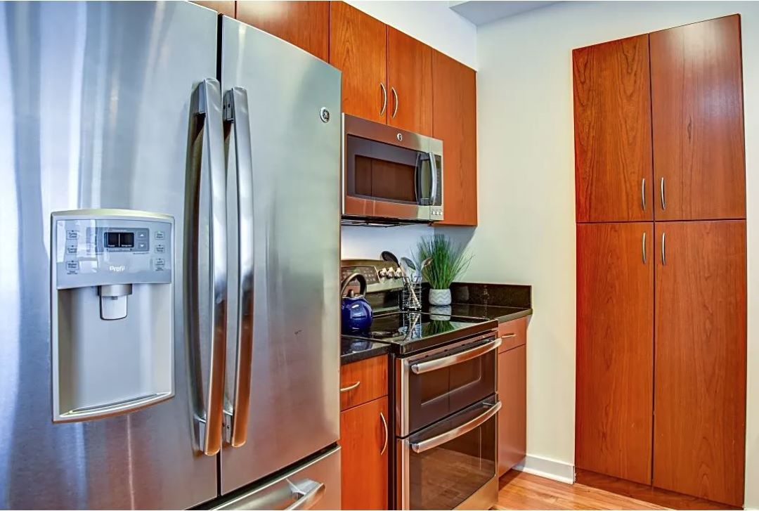 updated kitchen with designer cabinets and stainless appliances