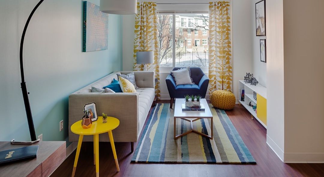 open concept living room with natural light and large window