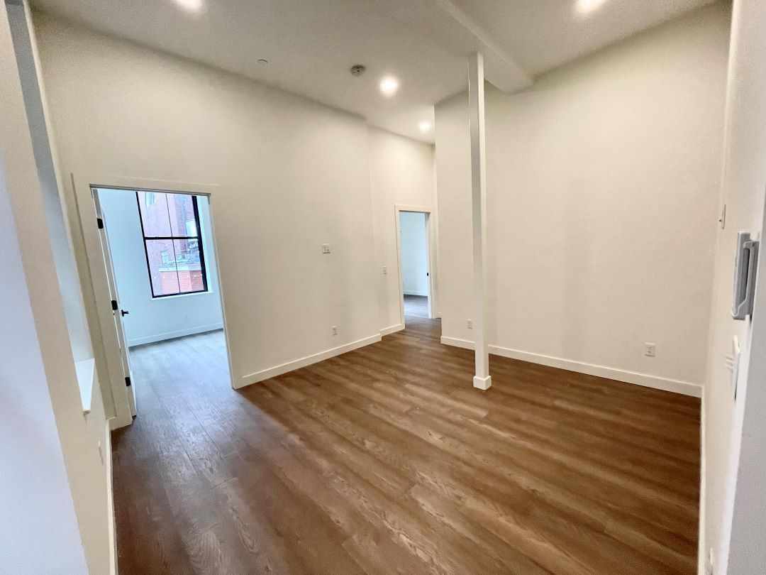 open floor plan living room with hardwood floors