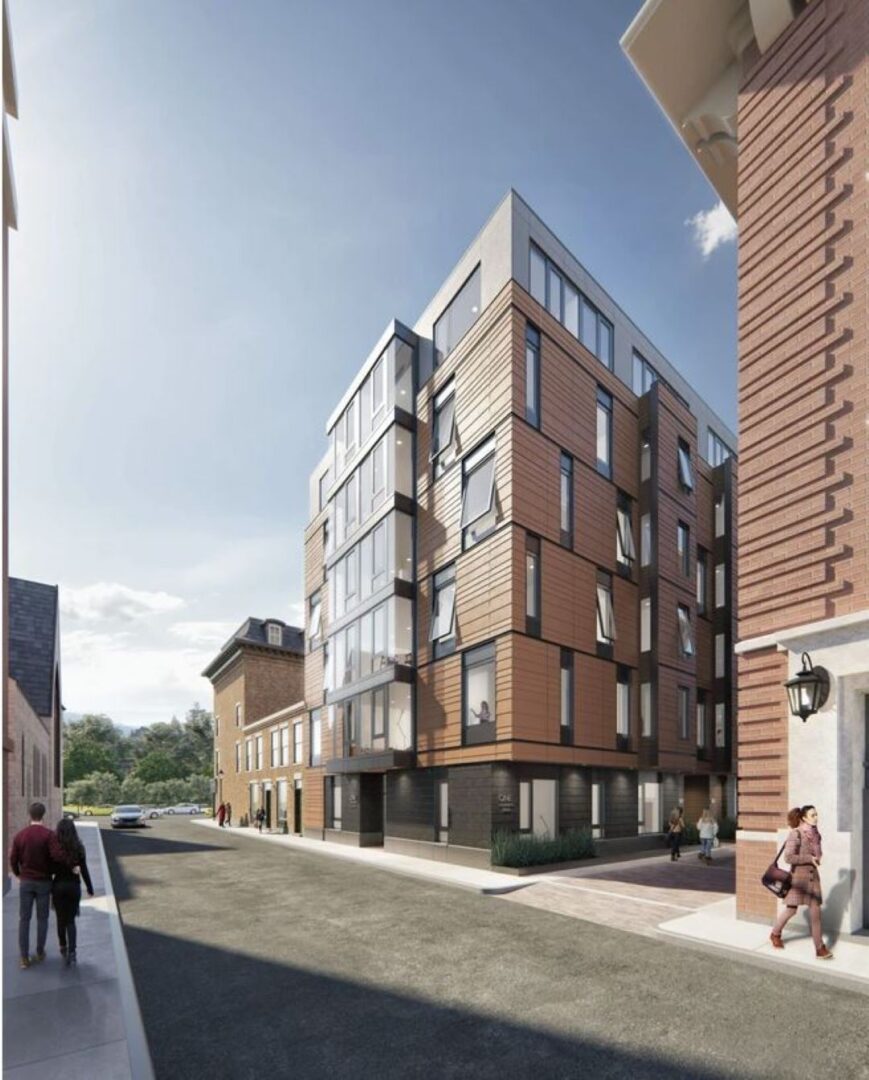 multi-story apartment building with brick exterior and large windows