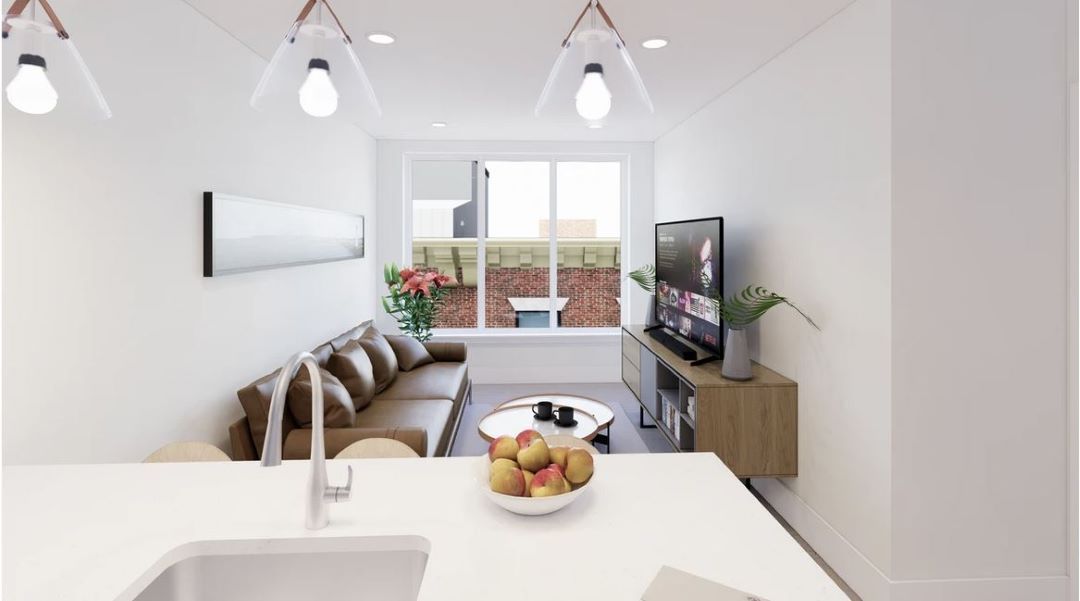 open concept living room with natural light and large window