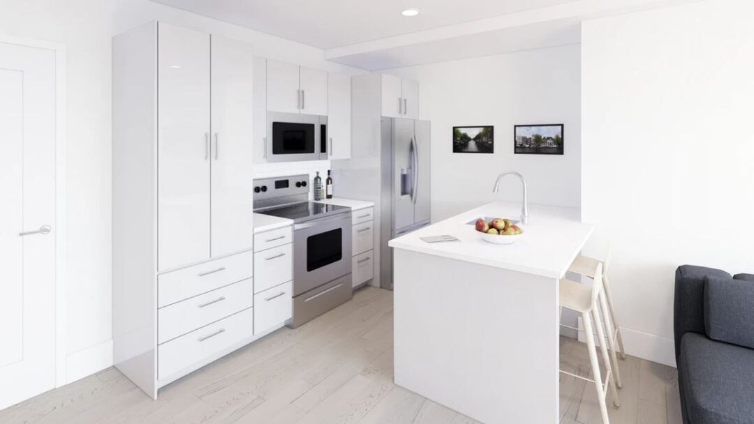 updated kitchen with white appliances and modern flooring