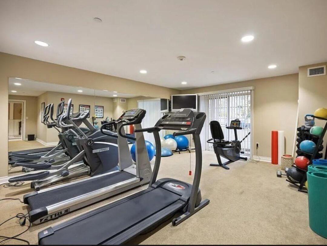 Large fitness center offering a variety of equipment.