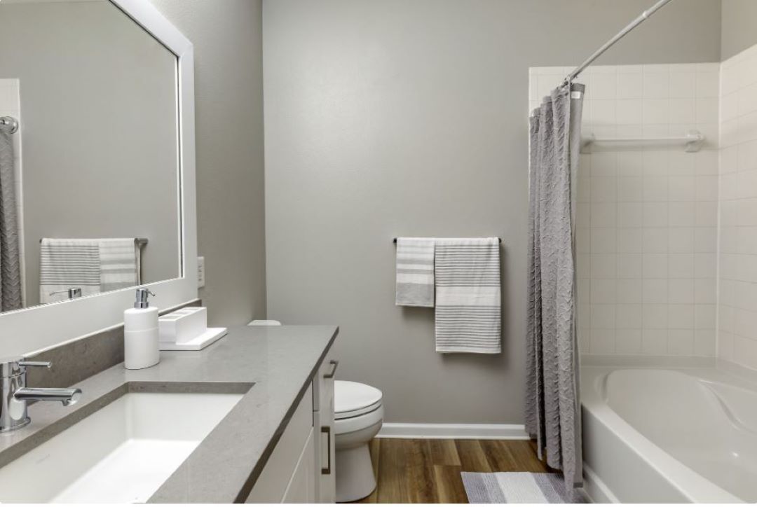 modern bathroom with tub and hardwood floors