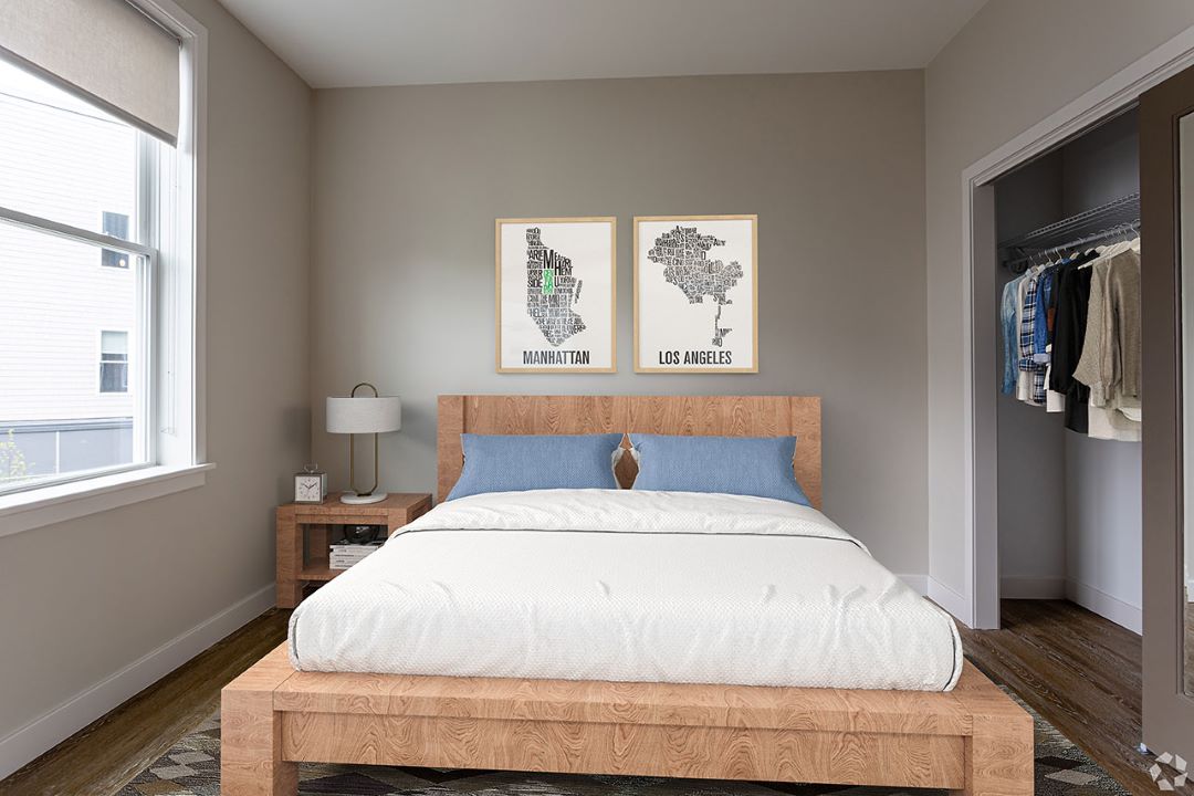 small beige bedroom with hardwood floors