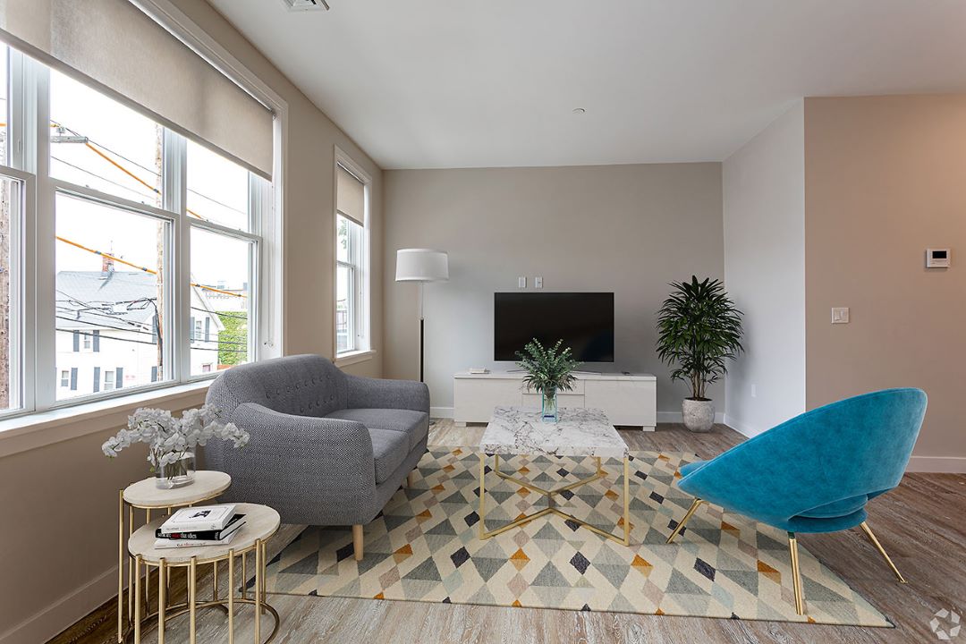 open concept living space with natural light and hardwood floors