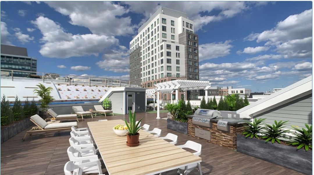 rooftop deck with patio and skyline views