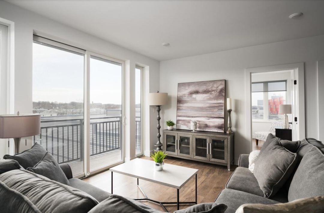 open concept living room with natural light and hardwood floors