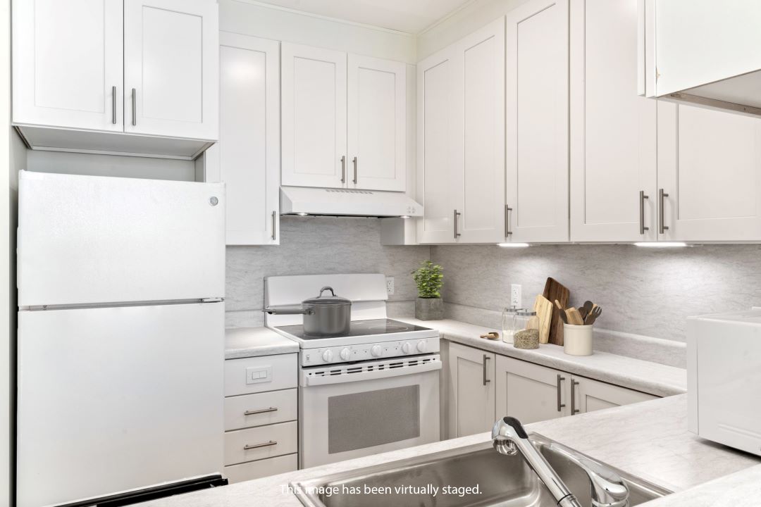 modern kitchen with white cabinets and appliances
