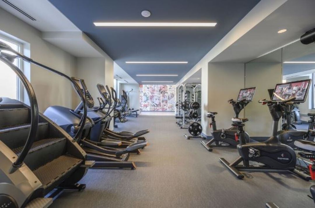 fitness center with an assortment of machines and weights