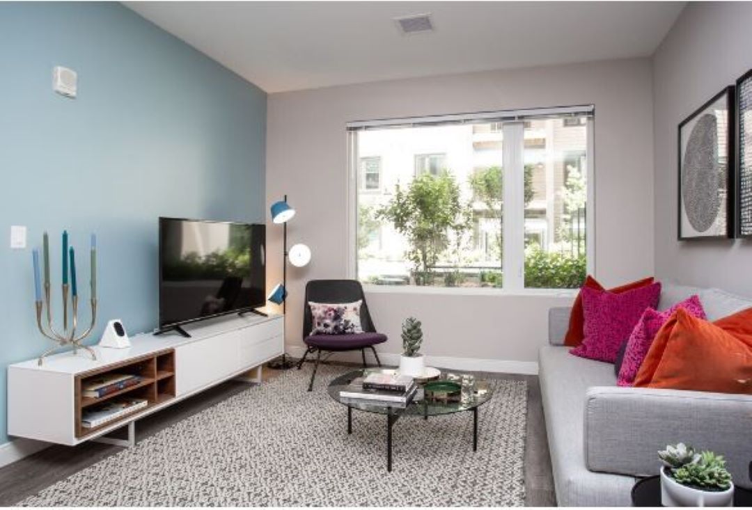 open concept living room with natural light and large window