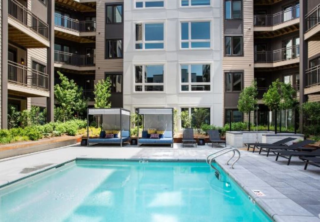 Big, Beautiful pool surrounded by outdoor deck/patio space