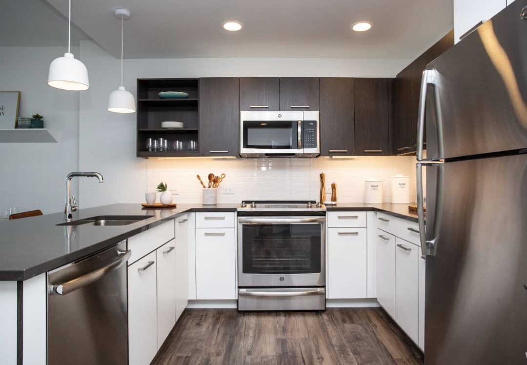 updated kitchen with modern cabinets, and appliances and hardwood floors