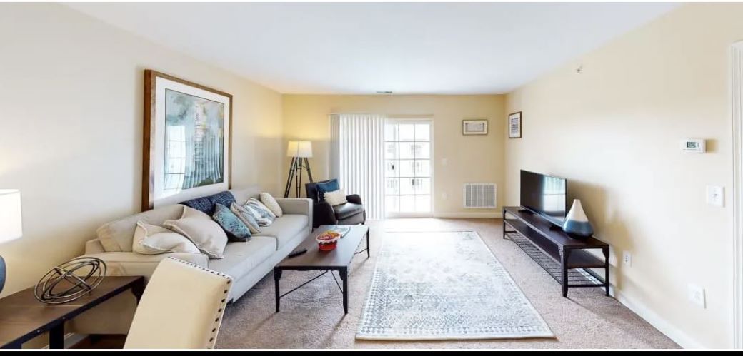 living room with hardwood floors and natural lighting