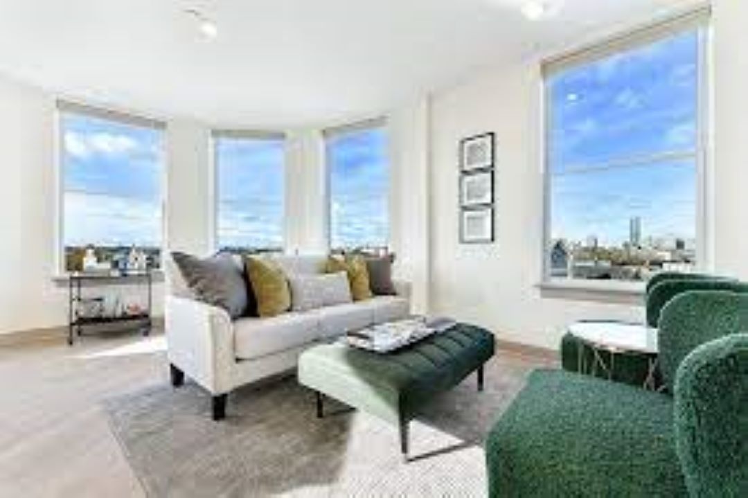 open concept living room with wood floors and natural light