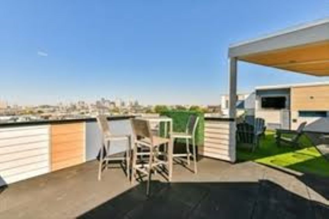 outdoor roof top deck with patio area and gas grills