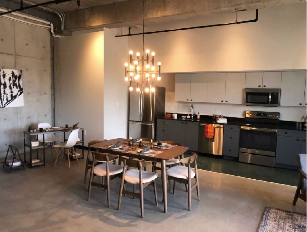 Updated kitchen with white cabinets and stainless steel appliances