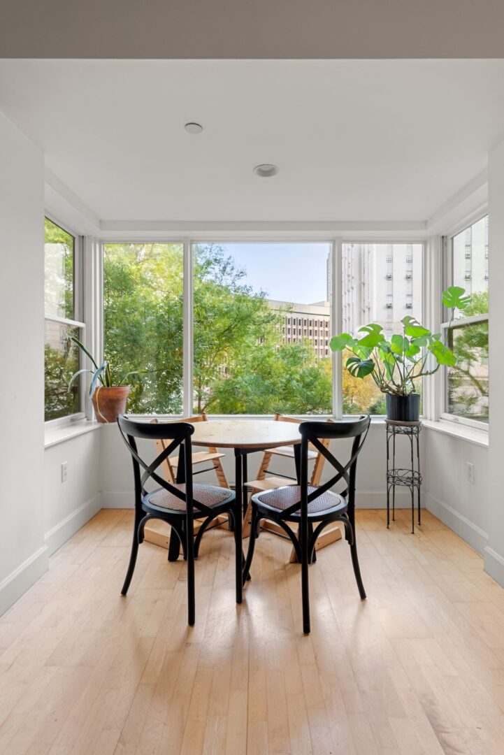 dining area with large windows and hardwood floors