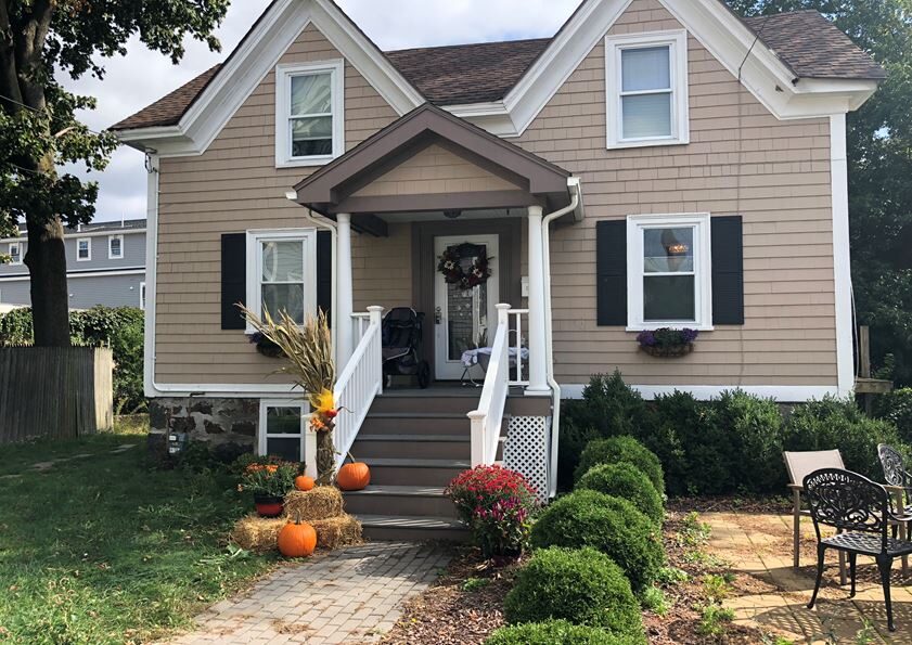 exterior of 23 Mason St. with front steps, w walkway and scrubs