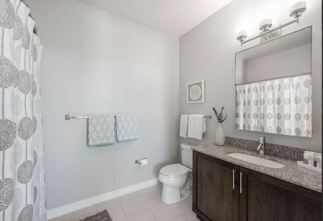 modern bathroom with vanity and toilet