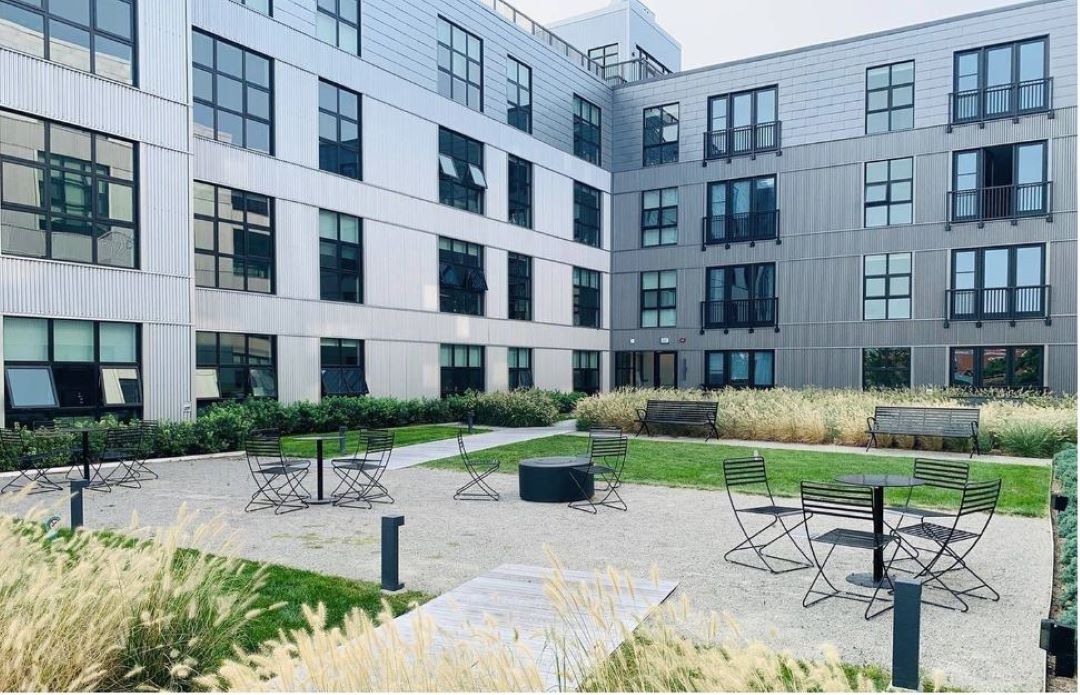 courtyard area of Graphic Lofts building with tables and chairs