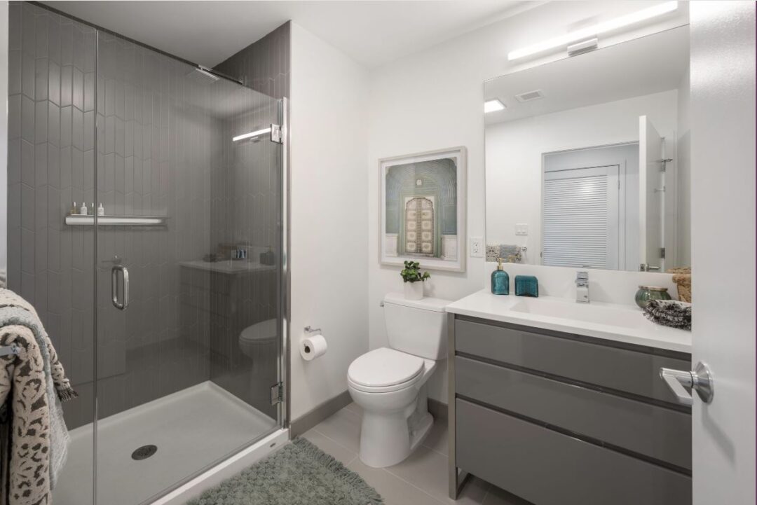 updated bathroom with stand up shower and tile floors