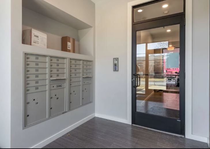 apartment style entrance with mailroom and glass door