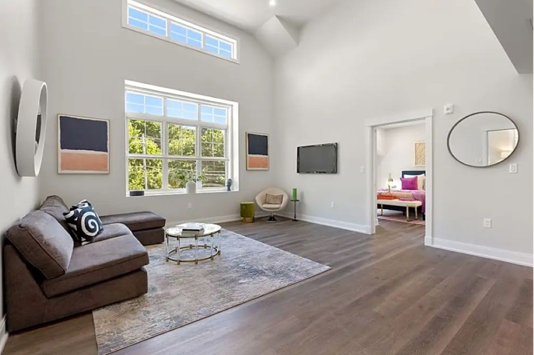 modern living room with wood floors and natural light