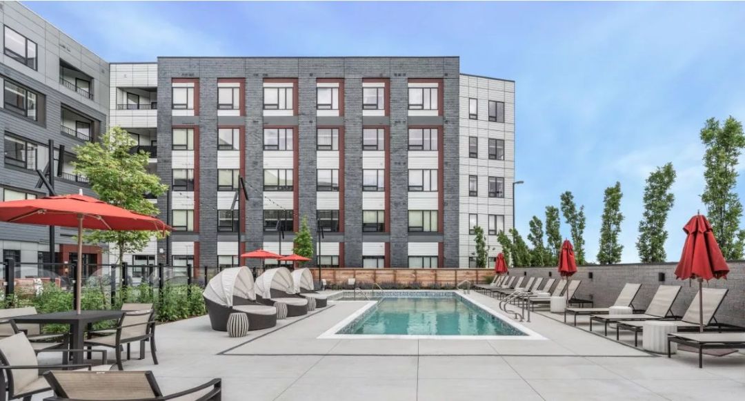 Atwood outdoor area with Olympic style pool and loungers