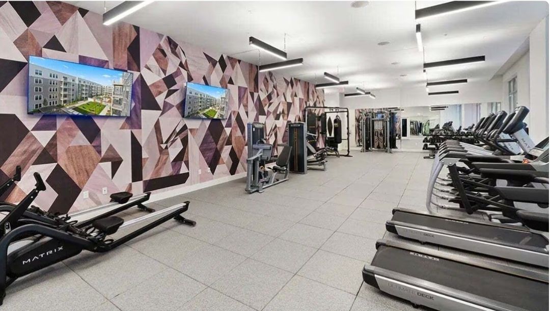 fitness center with an assortment of exercise equipment