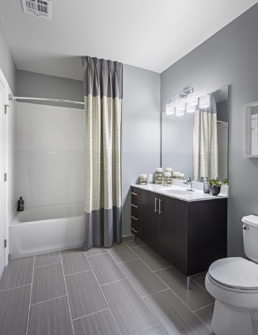 Modern bathroom with tile floors and large vanity