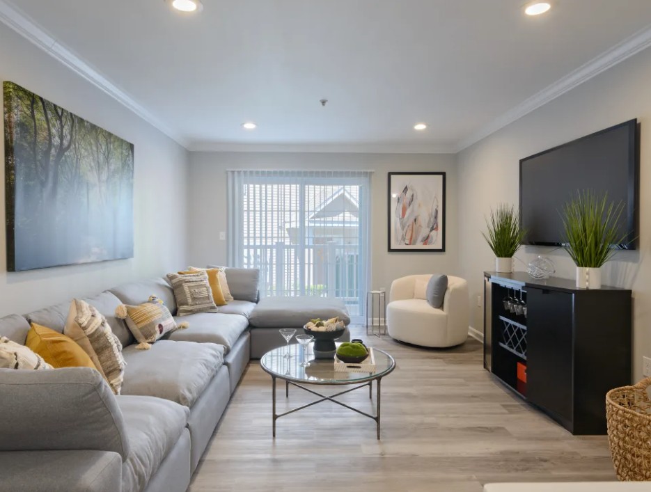 Bright bedroom with wood floors and single window
